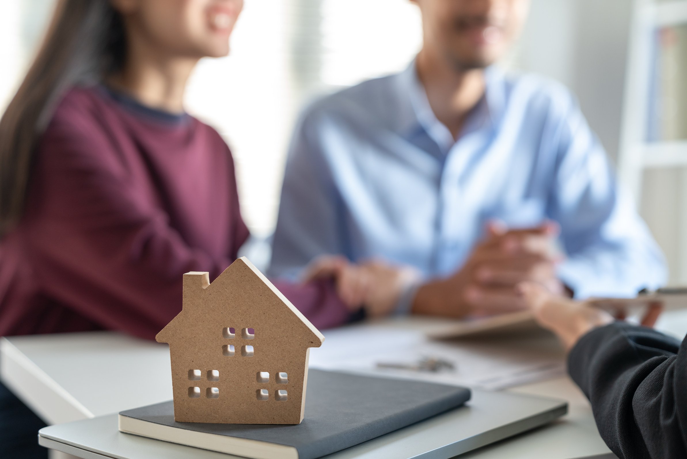 Young Family Couple Talking with Property Real Estate Agent